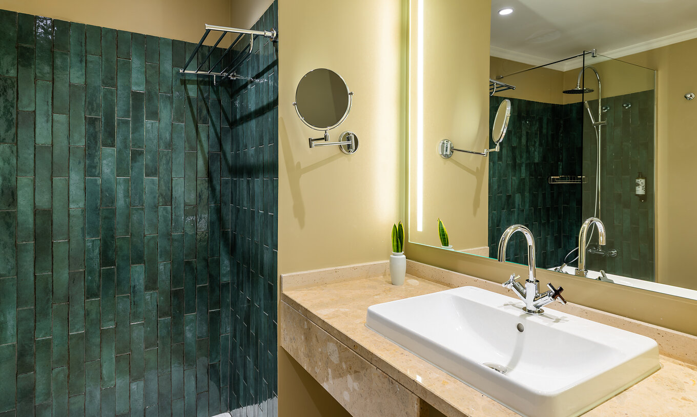 The Partial Sea View Room with Balcony at Pestana Quinta Perestrello has a bathroom with a washbasin and tiles.