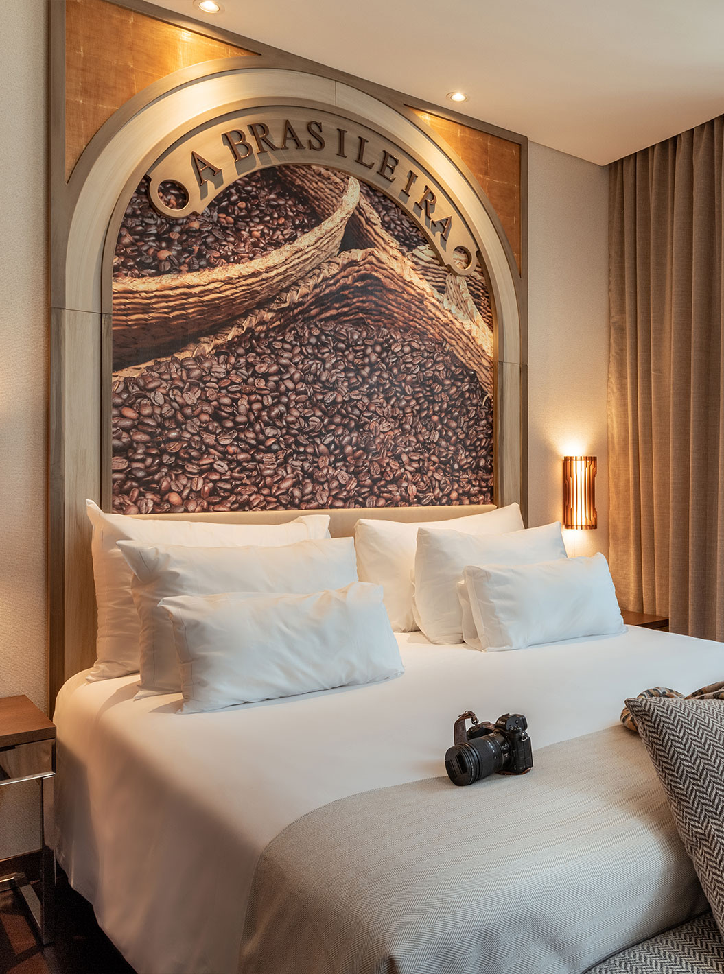 Suite A Brasileira at Pestana Porto - A Brasileira with king bed, coffee mural and tall curtained window