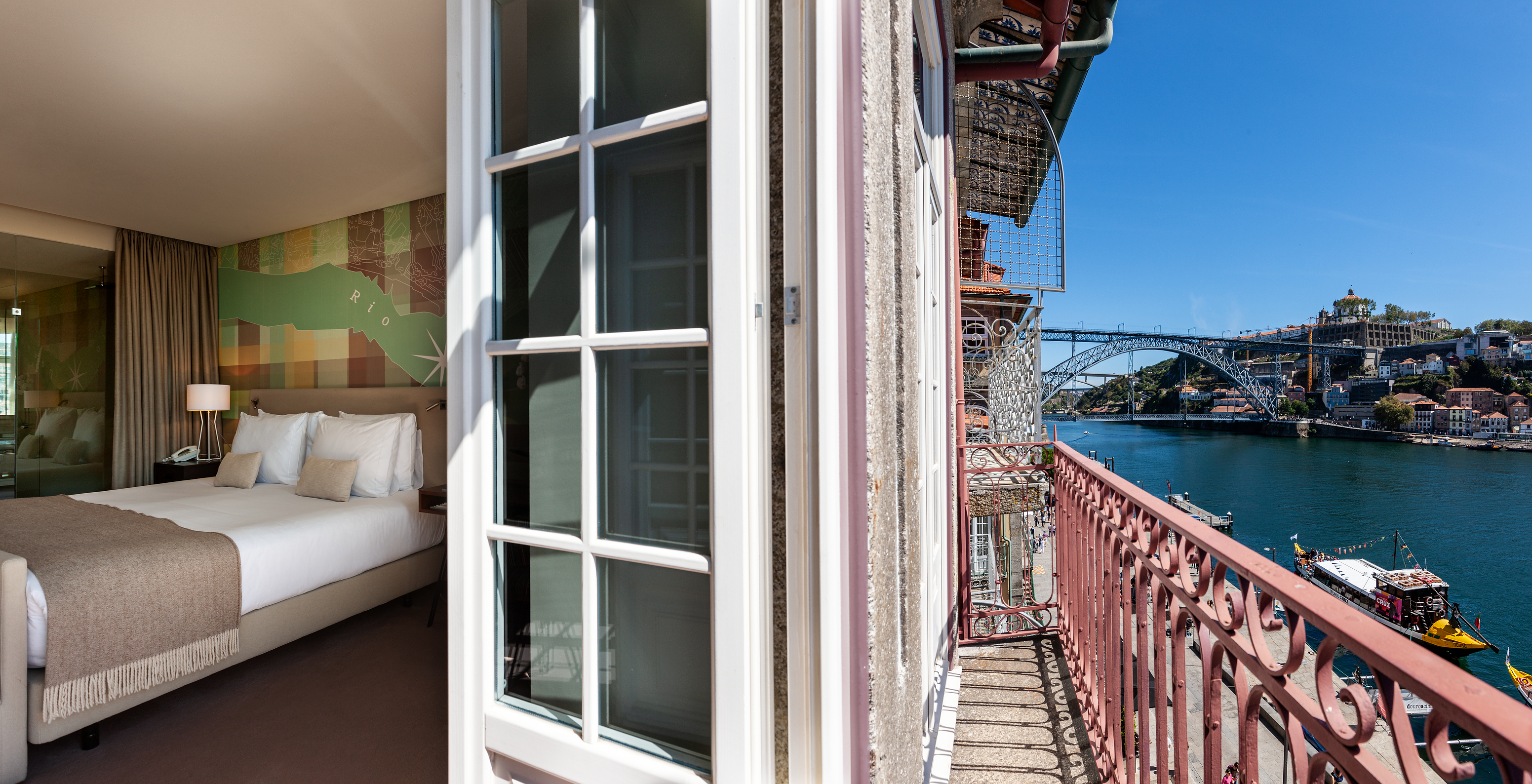 The Vintage Grand View Balcony room at Pestana Vintage Porto has an amazing view of the Ribeira and Dom Luís I Bridge