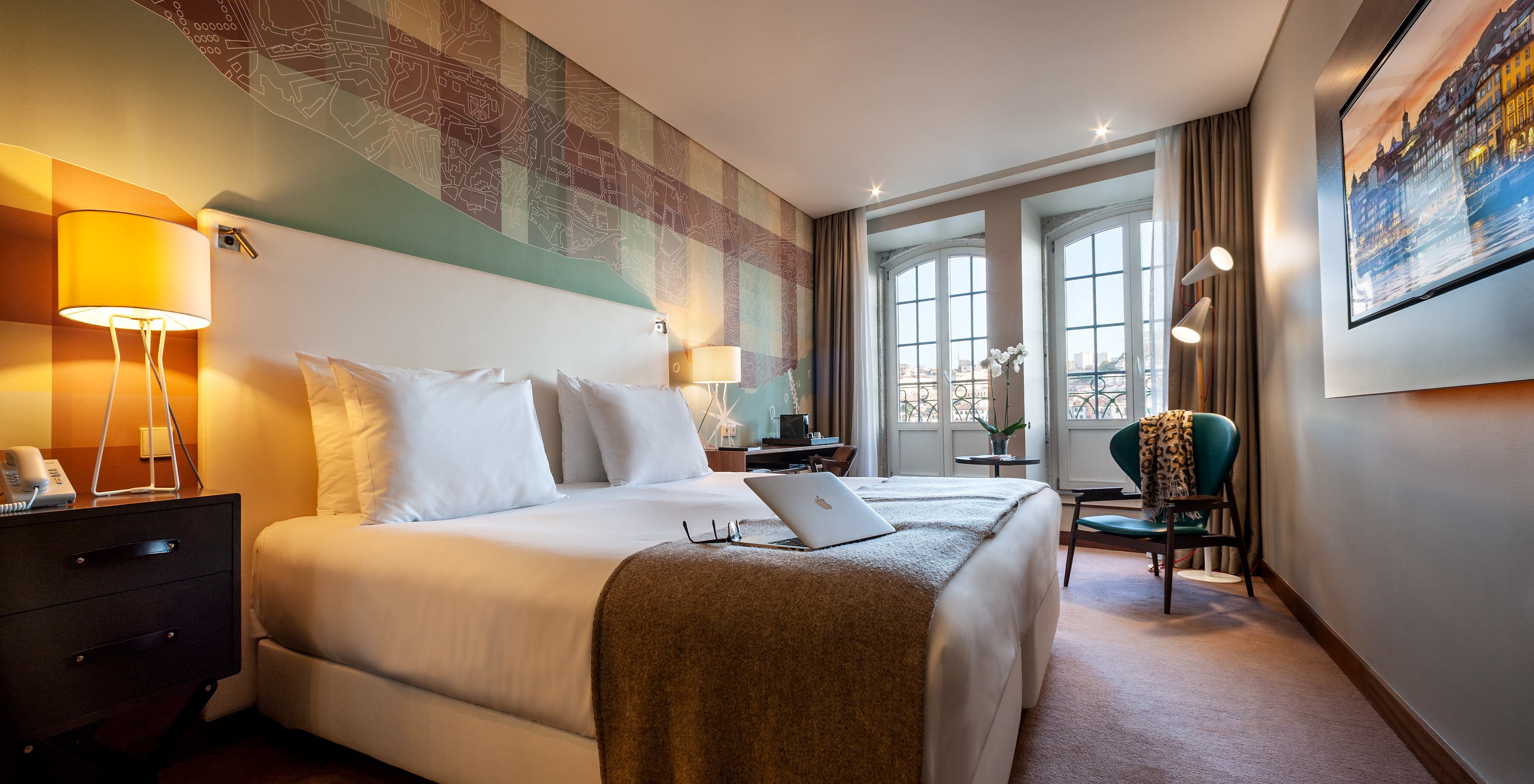 The Vintage River View Balcony room at Pestana Vintage Porto has a double bed, with two large windows with balcony