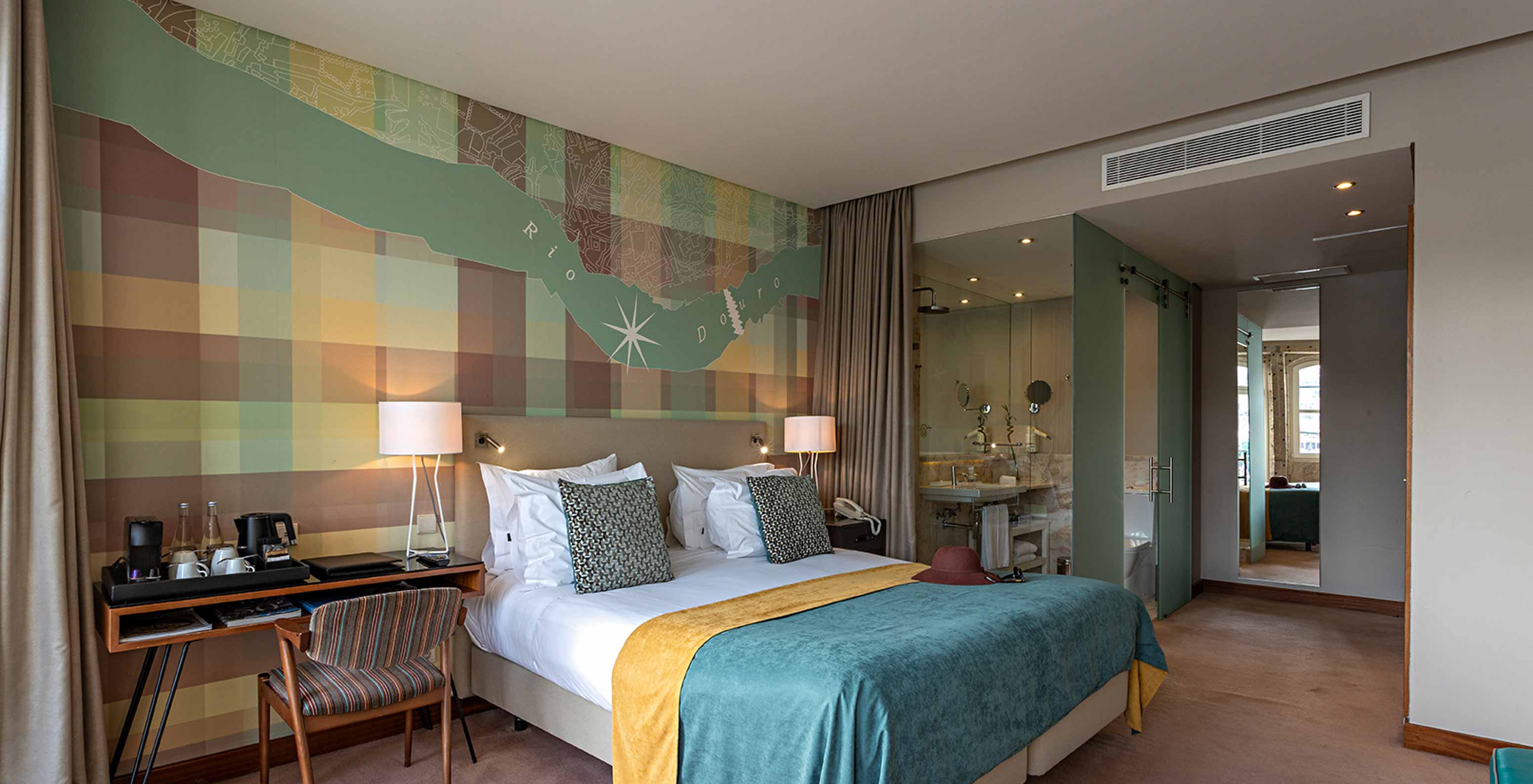 The Vintage River View Balcony room at Pestana Vintage Porto has a double bed, with two large windows with balcony