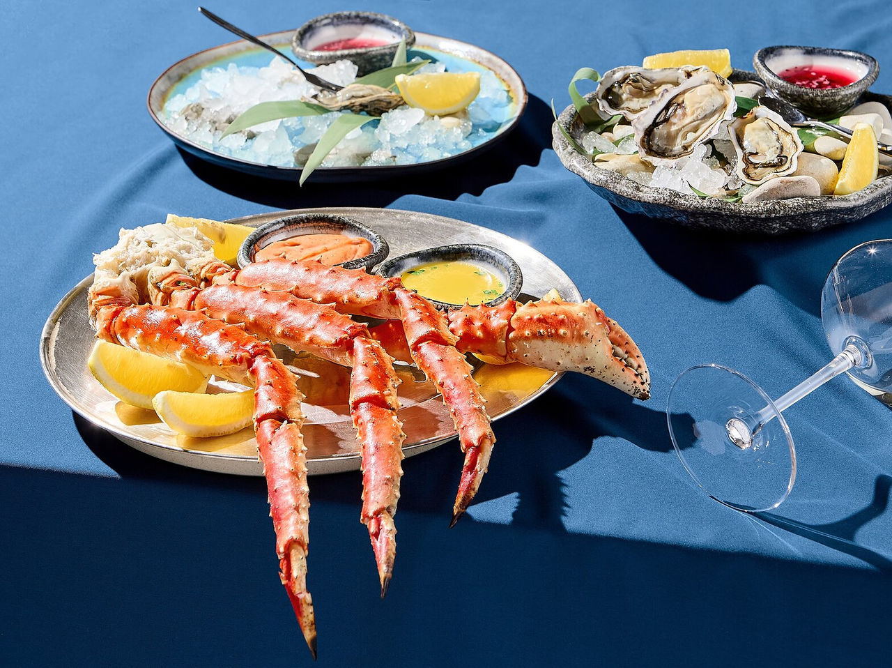 Explore Hotels in Cidade da Praia featuring seafood platters with oysters, king crab legs and lemon wedges