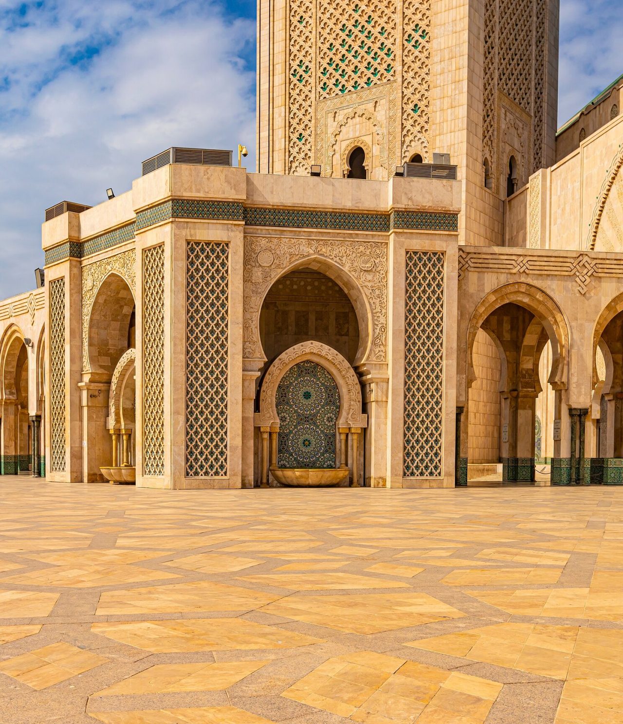 View of the lower part of the Hassan II Mosque, showcasing its arches and arcades
