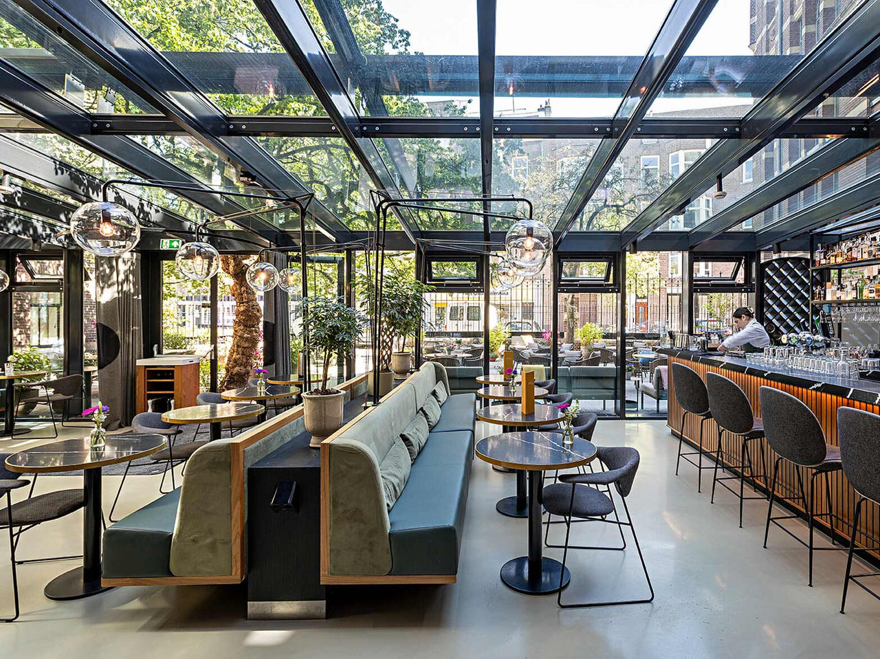 Bar at Pestana Amsterdam Riverside, 5-Star Hotel in Amsterdam, with glass roof seating and cocktail counter
