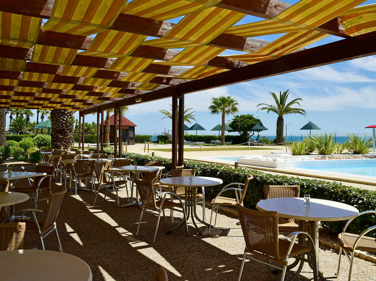 The Pool Bistro restaurant, at the 4-Star Hotel in Porches, includes a terrace above the pool where guests can order snacks