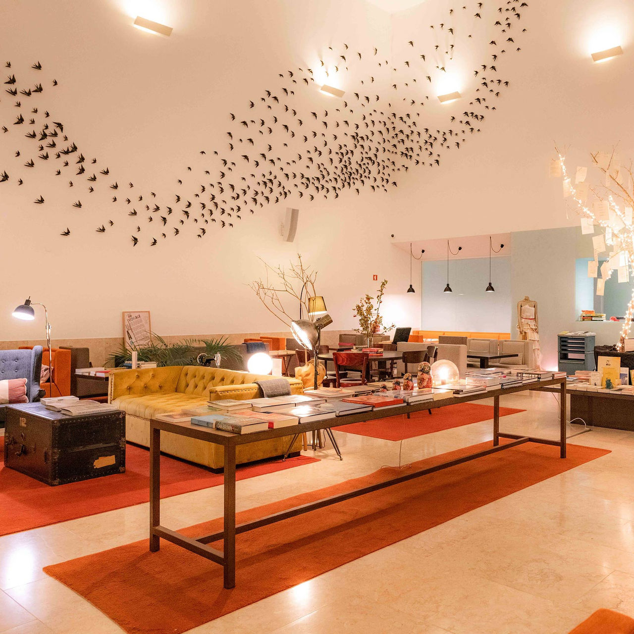 Pestana Cidadela Cascais, 5-Star Hotel in Cascais showcasing lounge with bird wall art and reading tables