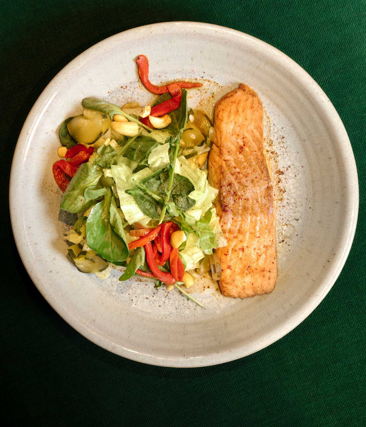 Restaurant at Pestana CR7 Lisboa, Hotel in the Historic Center of Lisbon, serving grilled salmon and salad