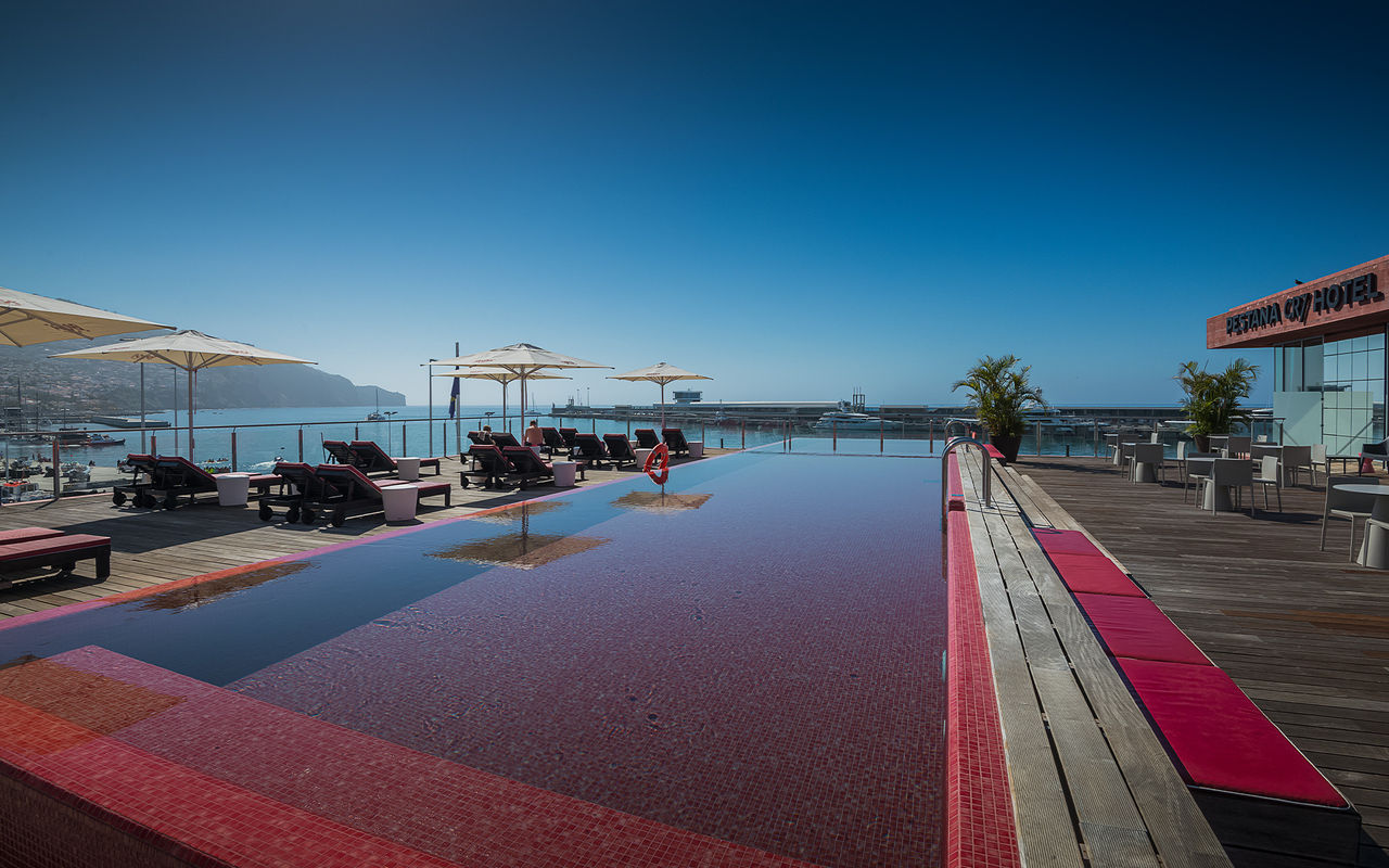 View of the pink outdoor pool facing the sea, at Cristiano Ronaldo's hotel in the center of Funchal