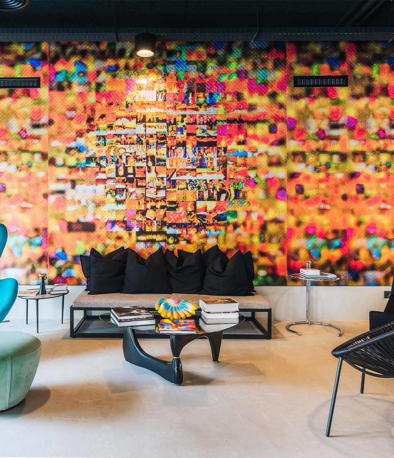 Corner, 4-Star Hotel in Madeira, has a colorful wall and sofas