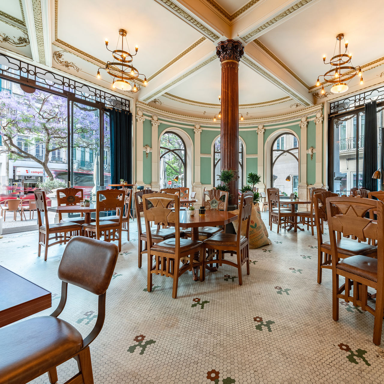 Interior of Café A Brasileira in the center of Porto, decorated with crystals, marble, and embossed leather furniture