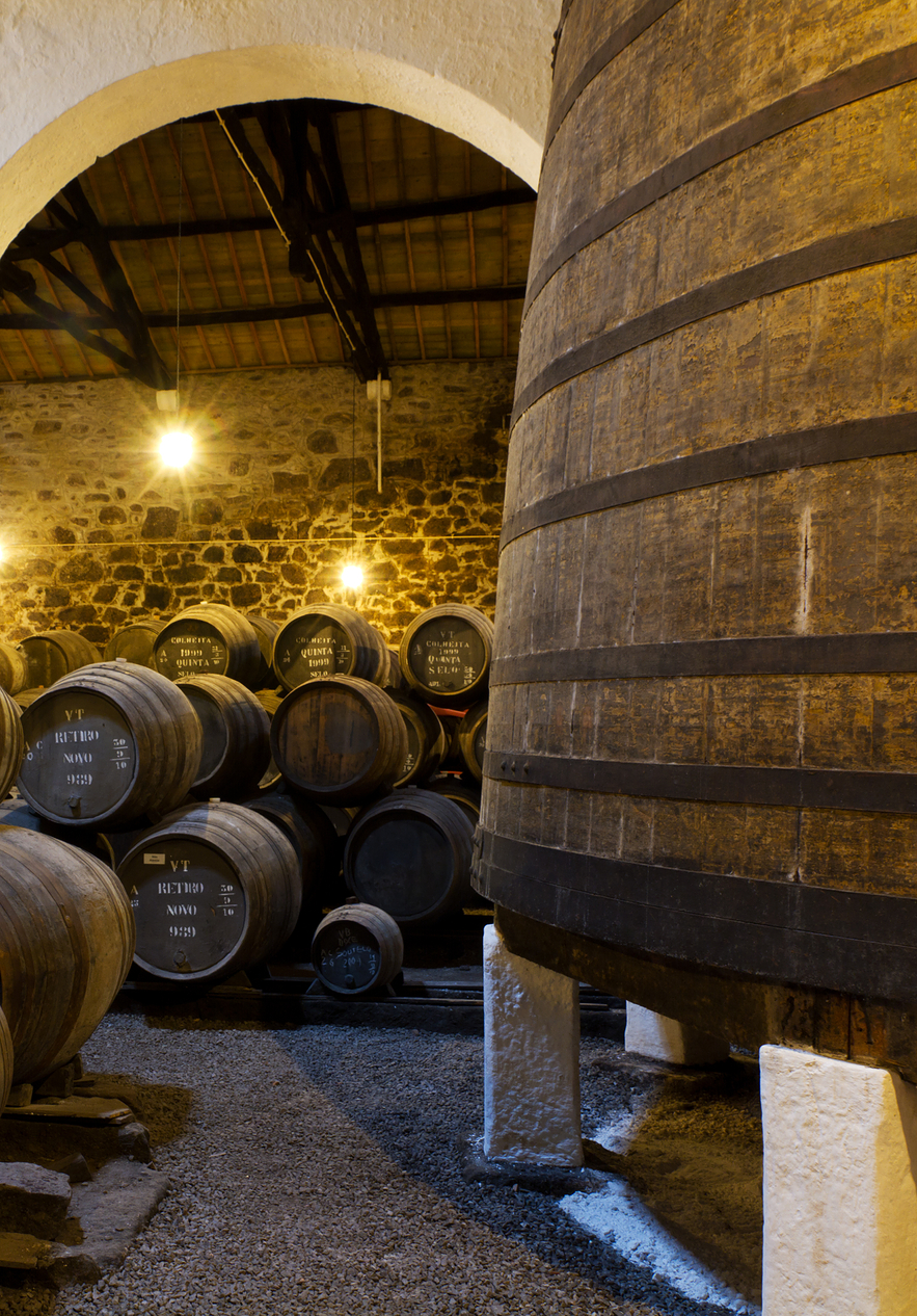 Stay at Pestana Vintage Porto and taste amazing wine at the Porto Wine Cellars with old barrels