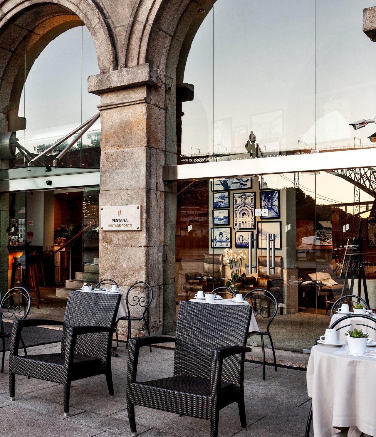 The Heritage bar, of the 5-Star Hotel in the Center of Porto, has an outdoor terrace with black chairs and tables