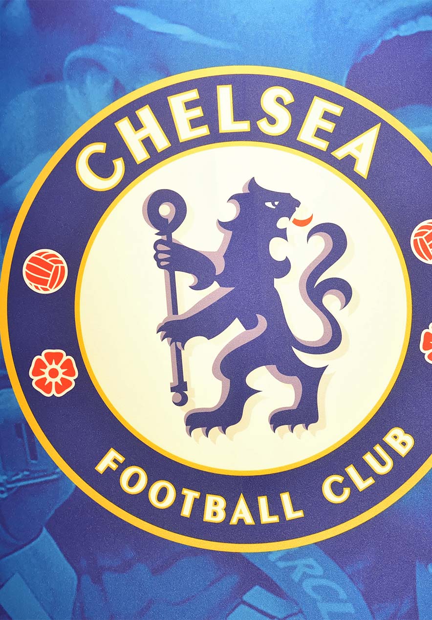 Chelsea Football Club emblem with a blue background with fans cheering at a match with a lion in the emblem
