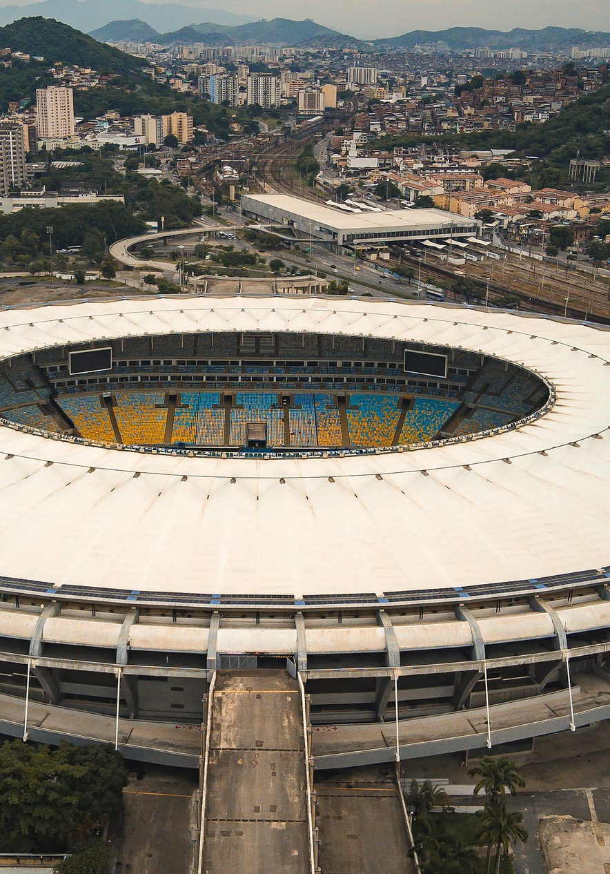 Maracanã Stadium in Rio de Janeiro with an imposing structure and colorful stands inside the stadium